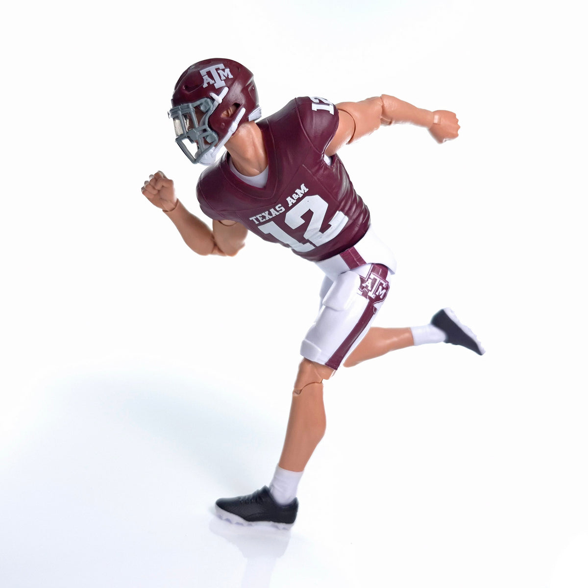 Collegiate Legends Texas A&M #12 football action figure in maroon and white uniform running in a dynamic pose