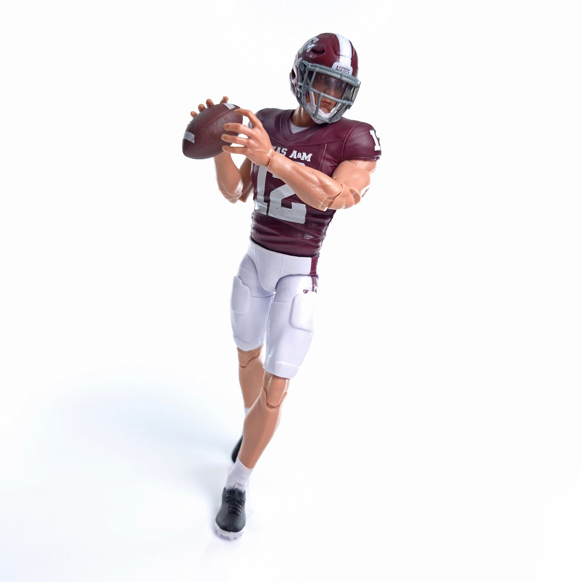 Collegiate Legends Texas A&M #12 football action figure in maroon and white uniform holding a football