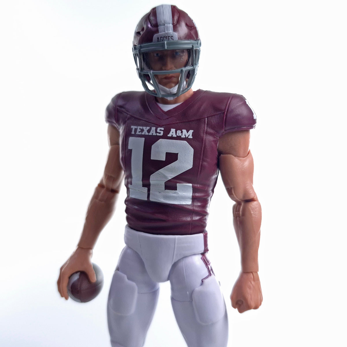 Collegiate Legends Texas A&M #12 football action figure in maroon and white uniform holding a football