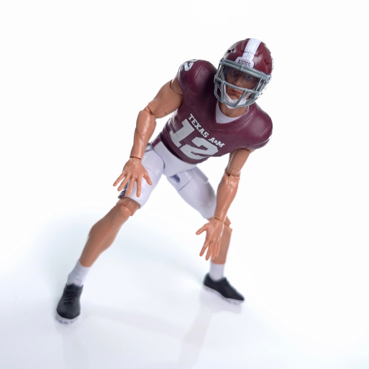 Collegiate Legends Texas A&M #12 football action figure in maroon and white uniform with articulated pose