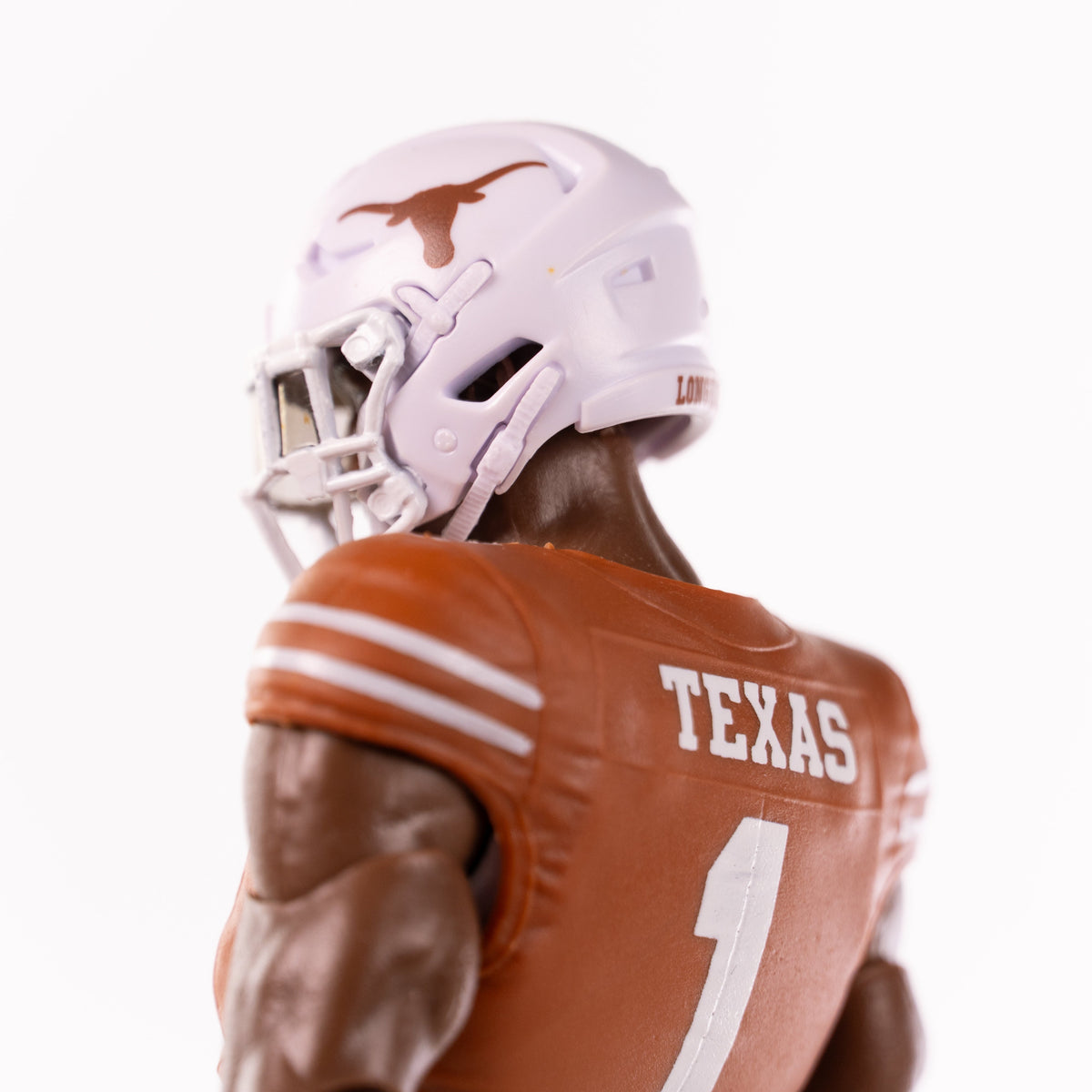 Collegiate Legends Texas football action figure wearing a burnt orange number 1 jersey and white Longhorns helmet