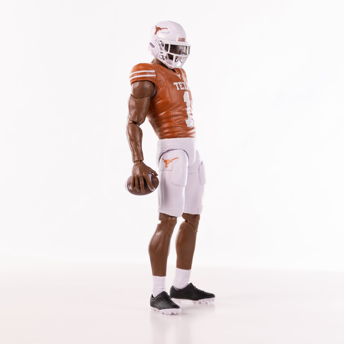 Collegiate Legends Texas Longhorns #1 football action figure in burnt orange jersey and white pants holding a ball